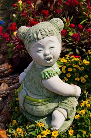 funny mischievous babies - Child statue in the garden. Stock Photo - Budget Royalty-Free & Subscription, Code: 400-05314806