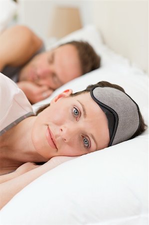 Lovely couple lying down in their bed Stock Photo - Budget Royalty-Free & Subscription, Code: 400-05314807