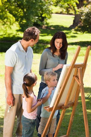 simsearch:400-04328345,k - Family painting together in the park Stock Photo - Budget Royalty-Free & Subscription, Code: 400-05314820