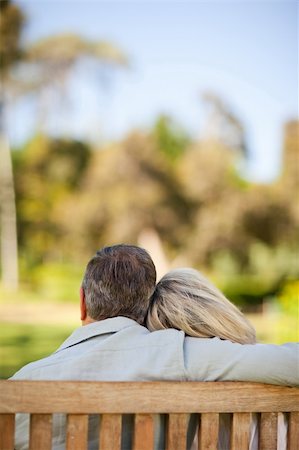 Elderly couple sitting on the bench with their back to the camera Stock Photo - Budget Royalty-Free & Subscription, Code: 400-05315002