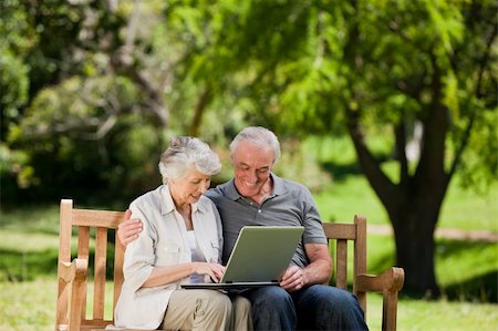 Elderly couple looking at their laptop Stock Photo - Budget Royalty-Free & Subscription, Code: 400-05315014