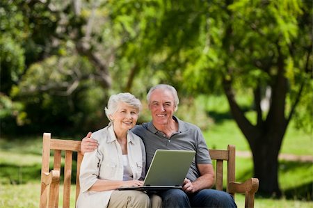 Elderly couple looking at their laptop Stock Photo - Budget Royalty-Free & Subscription, Code: 400-05315020