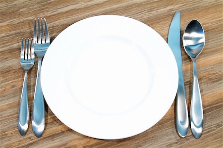 Modern silverware arranged in a place setting on a table Foto de stock - Royalty-Free Super Valor e Assinatura, Número: 400-05315056