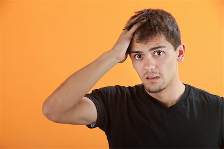 Upset Hispanic teen male with hand on head Stock Photo - Budget Royalty-Free & Subscription, Code: 400-05315165