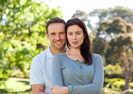 Beautiful couple hugging in the park Photographie de stock - Aubaine LD & Abonnement, Code: 400-05315357