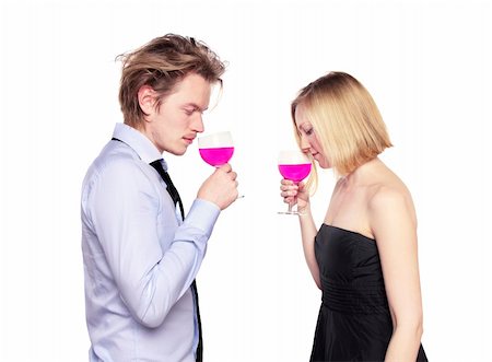 Young couple toasting with pink drink. Two people drinking. Studio photo., isolated. Stock Photo - Budget Royalty-Free & Subscription, Code: 400-05315417
