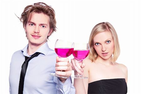 Young couple toasting with pink drink. Two people drinking. Studio photo, isolated. Stock Photo - Budget Royalty-Free & Subscription, Code: 400-05315418