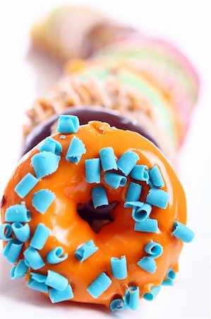 simsearch:400-04835290,k - Colorful and tasty donuts on white background Stock Photo - Budget Royalty-Free & Subscription, Code: 400-05315576