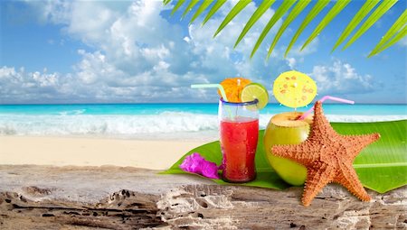 Coconut cocktail starfish tropical Caribbean beach refreshment Stock Photo - Budget Royalty-Free & Subscription, Code: 400-05316101
