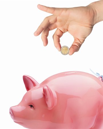 simsearch:400-04995456,k - Hand putting money into the piggy bank isolated on white Stockbilder - Microstock & Abonnement, Bildnummer: 400-05316596