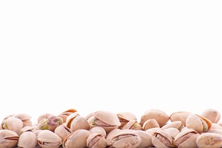 pistachio kernel - Pistachio Nuts with Space for Text Background Stock Photo - Budget Royalty-Free & Subscription, Code: 400-05316656