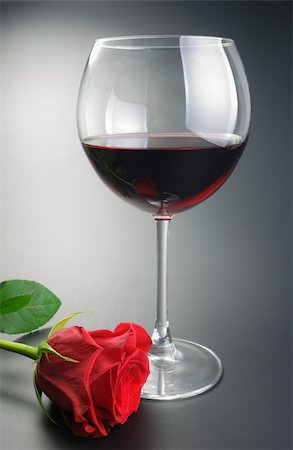 Glass of red wine and red rose flower arranged on neutral gradient background. Stock Photo - Budget Royalty-Free & Subscription, Code: 400-05316714