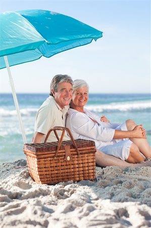 Elderly couple picniking on the beach Stock Photo - Budget Royalty-Free & Subscription, Code: 400-05316860