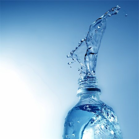 fresh spring drinking water - drinking water pouring from pvc bottle on blue Stock Photo - Budget Royalty-Free & Subscription, Code: 400-05316989
