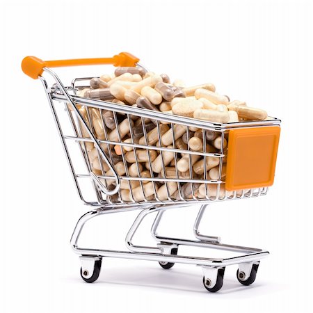 Carts on a white background filled with pills Stock Photo - Budget Royalty-Free & Subscription, Code: 400-05317119