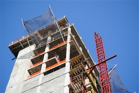 A building under construction with safety netting. Stock Photo - Budget Royalty-Free & Subscription, Code: 400-05317420