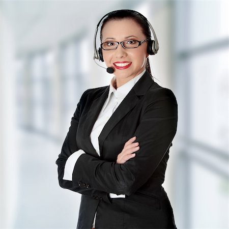 simsearch:400-04472832,k - Young business woman with headset Stock Photo - Budget Royalty-Free & Subscription, Code: 400-05317632