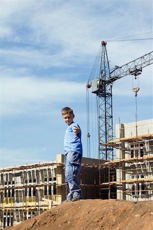 Little boy playing on a building area Stock Photo - Budget Royalty-Free & Subscription, Code: 400-05317867