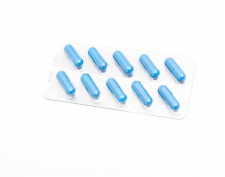 simsearch:600-03445205,k - macro of medical pills on white background Fotografie stock - Microstock e Abbonamento, Codice: 400-05318057