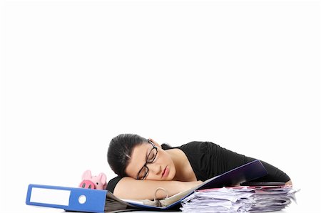 Exhausted female filling out tax forms while sitting at her desk.  Isolated on white Photographie de stock - Aubaine LD & Abonnement, Code: 400-05318203