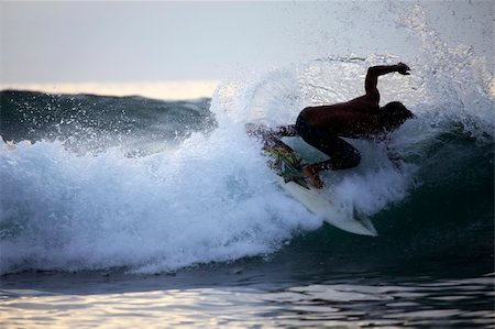 simsearch:400-07212763,k - Young men - the surfer in ocean. Bali. Indonesia Photographie de stock - Aubaine LD & Abonnement, Code: 400-05318366