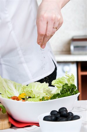 Preparation of vegetarian salad from fresh vegetables Stock Photo - Budget Royalty-Free & Subscription, Code: 400-05318371