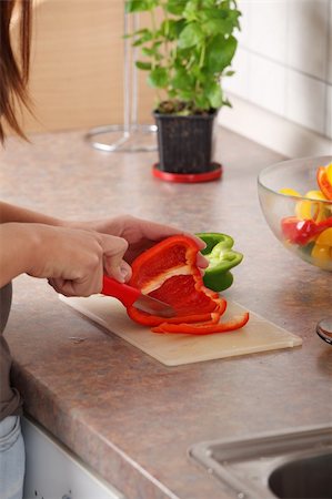 Female chopping food ingredients (paprika) on the kitchen. Stock Photo - Budget Royalty-Free & Subscription, Code: 400-05318471