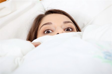 domineering wife - Scared young woman in bed. Foto de stock - Super Valor sin royalties y Suscripción, Código: 400-05318484