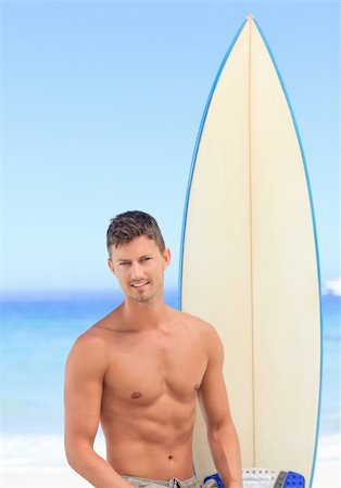 simsearch:400-05319489,k - Handsome man with his surfboard Stock Photo - Budget Royalty-Free & Subscription, Code: 400-05318618