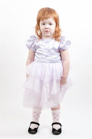 Beautiful young girl with red hair in pink dress Fotografie stock - Microstock e Abbonamento, Codice: 400-05318775