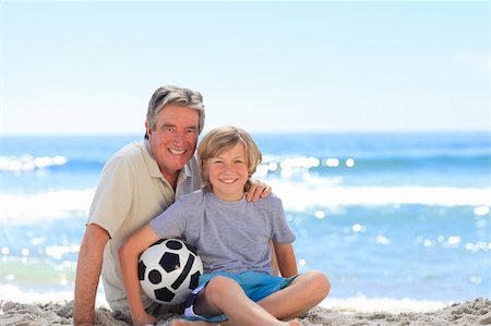 Grandfather and his grandson with a ball Stock Photo - Budget Royalty-Free & Subscription, Code: 400-05318857