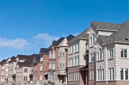A newly built row of townhouses nears completion. Stock Photo - Budget Royalty-Free & Subscription, Code: 400-05318908