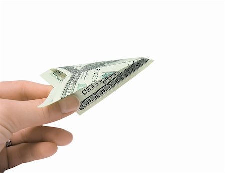 simsearch:400-08997019,k - Hand and money plane isolated on white background Stock Photo - Budget Royalty-Free & Subscription, Code: 400-05319661