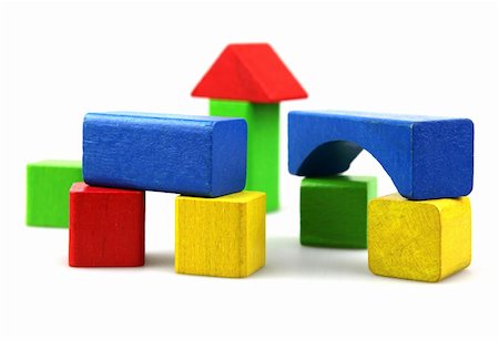 Wooden building blocks on white background. Close Up. Fotografie stock - Microstock e Abbonamento, Codice: 400-05319788