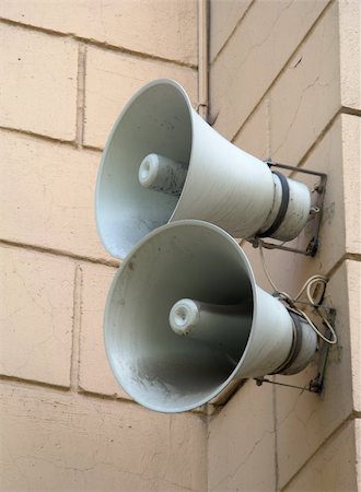 Two speakers are installed on a wall of a building Photographie de stock - Aubaine LD & Abonnement, Code: 400-05319926