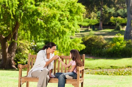 portrait of family on park bench - Cute girl with her mother in the park Stock Photo - Budget Royalty-Free & Subscription, Code: 400-05319920