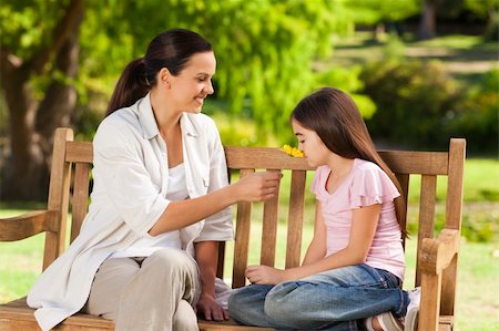portrait of family on park bench - Cute girl with her mother in the park Stock Photo - Budget Royalty-Free & Subscription, Code: 400-05319921