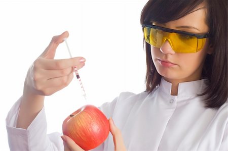 Woman scientist injecting chemicals into apple on white Stock Photo - Budget Royalty-Free & Subscription, Code: 400-05319968