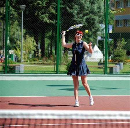 simsearch:400-06061549,k - young fit woman play tennis outdoor on orange tennis field at early morning Photographie de stock - Aubaine LD & Abonnement, Code: 400-05310024