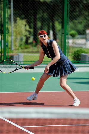 simsearch:400-06061549,k - young fit woman play tennis outdoor on orange tennis field at early morning Photographie de stock - Aubaine LD & Abonnement, Code: 400-05310026