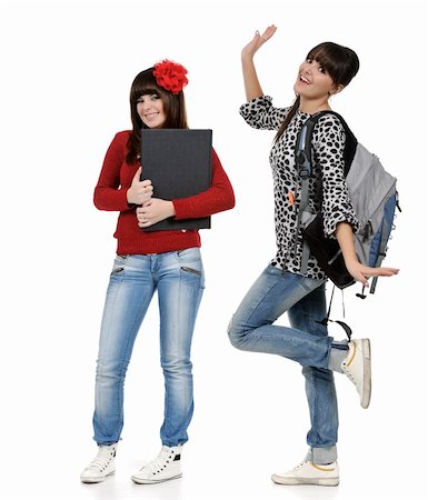 two friends with a backpack and a book posing Stock Photo - Budget Royalty-Free & Subscription, Code: 400-05310187