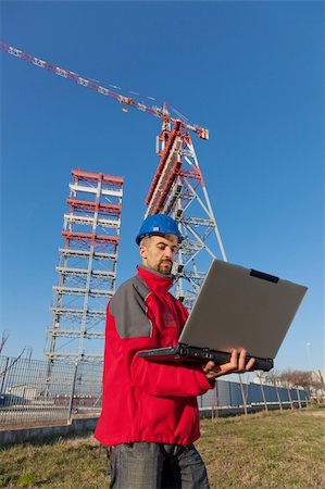 Engineer with Computer in Construction Site Stock Photo - Budget Royalty-Free & Subscription, Code: 400-05310277