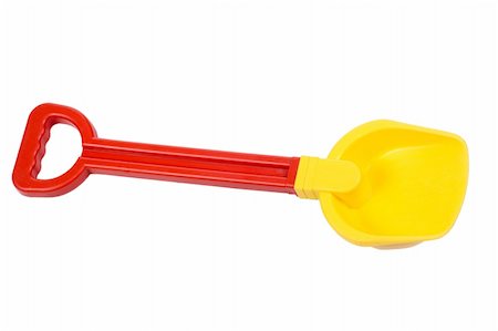 shovel in dirt - One red yellow kid's shovel isolated on white Stock Photo - Budget Royalty-Free & Subscription, Code: 400-05310458