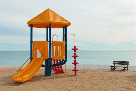 Colorful plastic chute on a beach playground Stock Photo - Budget Royalty-Free & Subscription, Code: 400-05310570