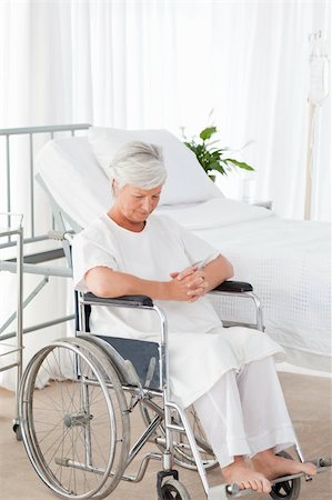 simsearch:400-04327275,k - Senior woman in her wheelchair Stockbilder - Microstock & Abonnement, Bildnummer: 400-05310729