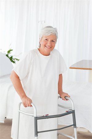 simsearch:400-05020346,k - Senior woman looking at the camera with her zimmer frame Stock Photo - Budget Royalty-Free & Subscription, Code: 400-05310731