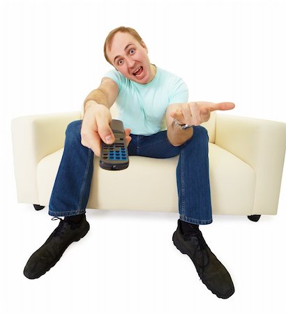 shouting television - emotional man with a TV remote control sitting on the couch Stock Photo - Budget Royalty-Free & Subscription, Code: 400-05311788