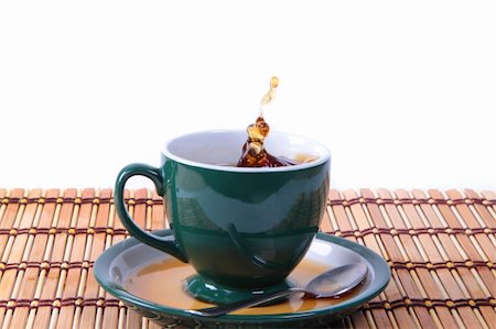 cup of green tea with splash isolated Stock Photo - Budget Royalty-Free & Subscription, Code: 400-05312479