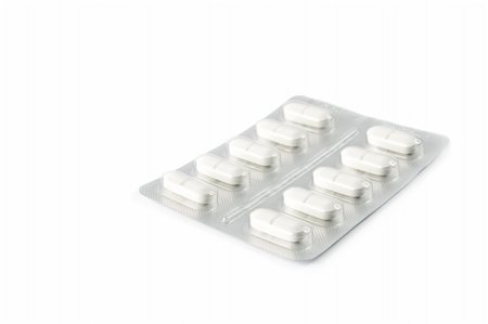 simsearch:400-04347597,k - Blister pack of pills isolated on white Fotografie stock - Microstock e Abbonamento, Codice: 400-05312923