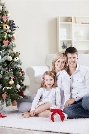 Families with a child at home with decked spruce Stock Photo - Budget Royalty-Free & Subscription, Code: 400-05313007